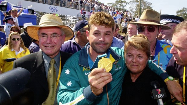 Michael Diamond, pictured with his mum and John Howard, holds his gold medal at the Sydney Games.