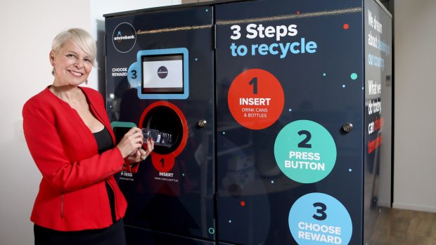 Narelle Anderson with one of her Envirobank reverse vending machines. 