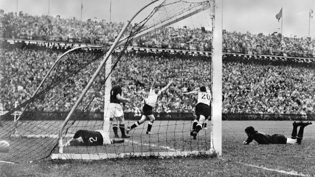 West Germany's Helmut Rahn equalises with Hungary in the 1954 World Cup final in Switzerland.