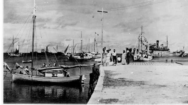 People on a dock in Jaluit Atoll, Marshall Islands. The documentary "Amelia Earhart: The Lost Evidence" argues that Earhart and her navigator, Fred Noonan, crash-landed in the Japanese-held Marshall Islands, were picked up by Japanese military and that Earhart was taken prisoner.