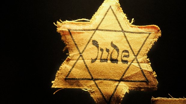 A cloth star with the word 'Jude', German for Jew, that Jews had to wear during the Nazi occupation.