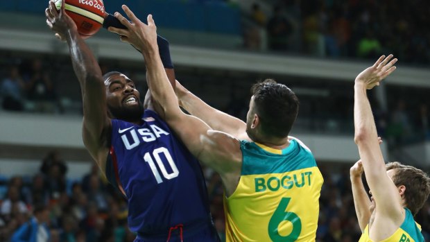Games on: Kyrie Irving of United States shoots over Andrew Bogut and Ryan Broekhoff of Australia during the Men's Preliminary Round Group A at the Rio Olympics in 2016.