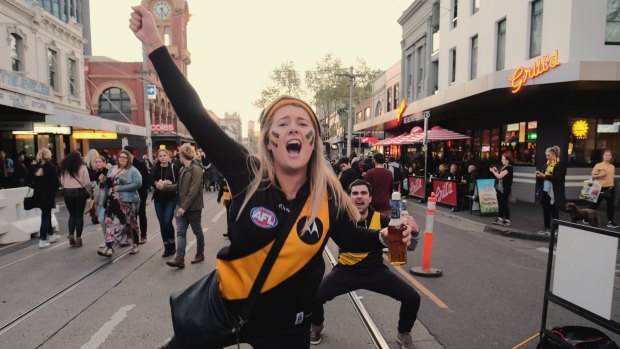 Richmond supporters on Swan Street celebrating their team’s win over Adelaide during the 2017 grand final. 