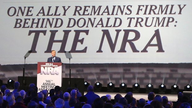 Strong ties: NRA's Chris Cox introduces President Donald Trump at the a Leadership Forum last year.