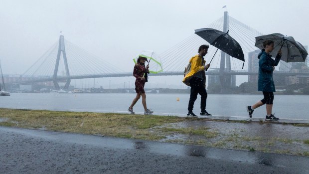 An east coast low enveloped Sydney on Wednesday, bring torrential rain and storms. 