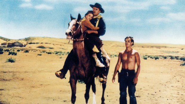 From left, Natalie Wood, John Wayne and  Jeffrey Hunter in <i>The Searchers</i>.