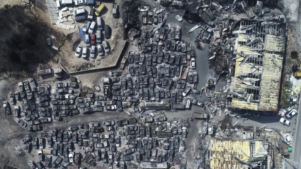An aerial photo showing burnt vehicles filling a junkyard after being hit by a massive forest fire in Sokcho, South Korea.