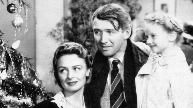 Donna Reed, James Stewart and 
Karolyn Grimes in Frank Capra's 1946 film It's a Wonderful Life.