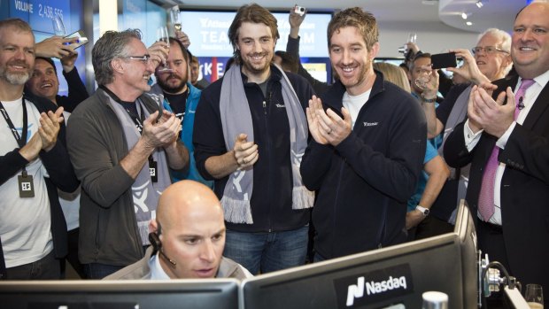 UNSW graduates and Atlassian co founders Mike Cannon-Brookes (left, with scarf) and Scott Farquhar watch as shares open on the Nasdaq.  