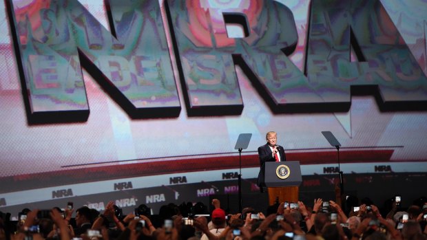 US President Donald Trump speaks at the National Rifle Association Leadership Forum in Atlanta on Friday.