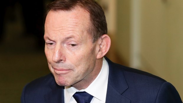 Tony Abbott exits the party-room meeting on Friday.