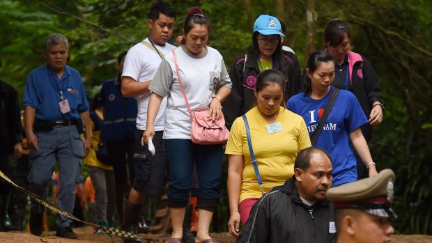 The families of the trapped boys and their coach return from praying at Tham Luang cave. Rescue efforts continue at Tham Luang cave where the 12 boys and their soccer coach have been trapped for 15 days.