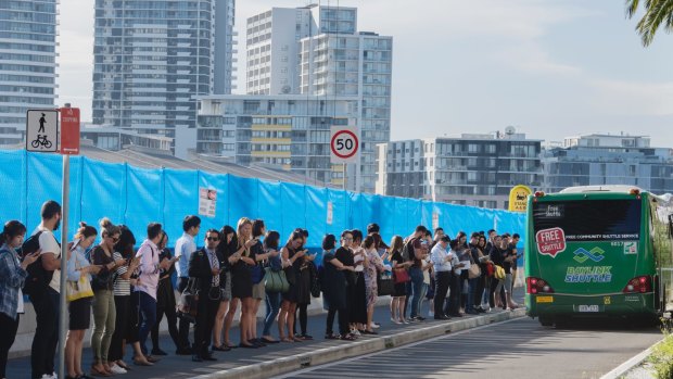 Thousands of people and no public transport: People queue for buses at Wentworth Point. 