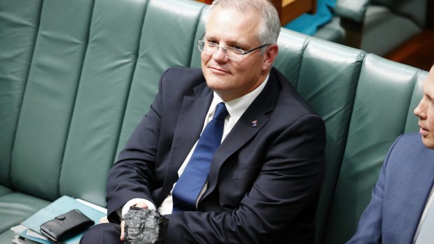 Prime Minister Scott Morrison holding a  lump of coal during question time in 2017.
