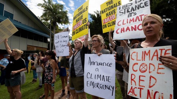 Protesters at Lismore Council Chambers wait for the Prime Minister Scott Morrison on March 9.