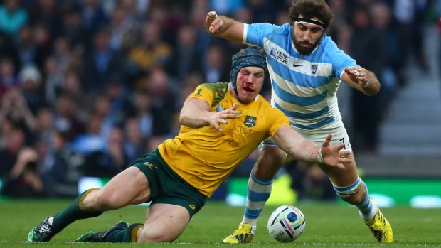 Showpiece: David Pocock and Argentina's Juan Martin Fernandez Lobbe compete for the ball during the 2015 Rugby World Cup semi final.