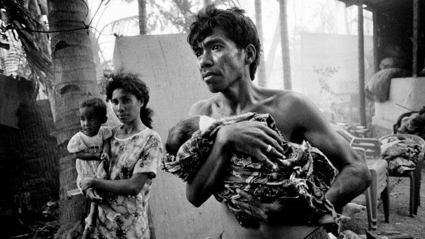 East Timorese return to the burnt out remains of their homes only to find rogue elements with the departing Indonesian Military burning nearby buildings.