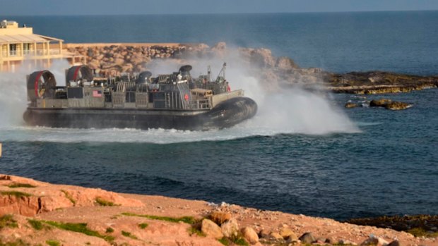 A US amphibious hovercraft departs with evacuees from Janzur, west of Tripoli, Libya, last week amid deteriorating security conditions.