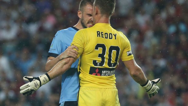 Flashpoint:  Matt Jurman of Sydney FC and Wanderers goalkeeper Liam Reddy face off.