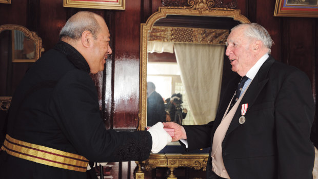 His Late Majesty King Tupou V awarding William Waterhouse the order Commander of the Crown of Tonga (later a Tongan Knighthood) for more than 30 years of service to the Kingdom of Tonga in 2008.