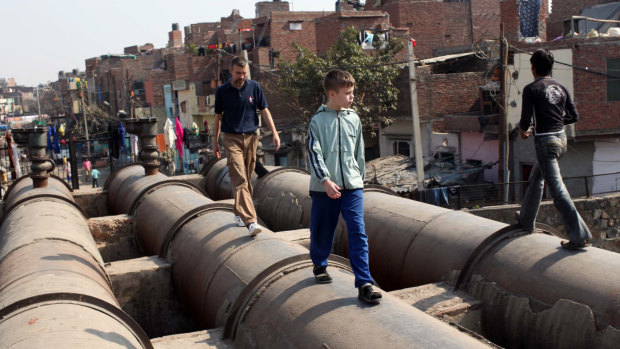 Mark Delaney with his son Tom near their Delhi home in 2009.