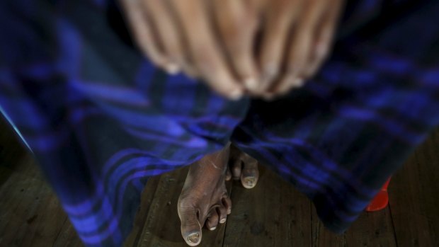 A victim of forced labor speaks during an interview in a village in northern Myanmar this month.