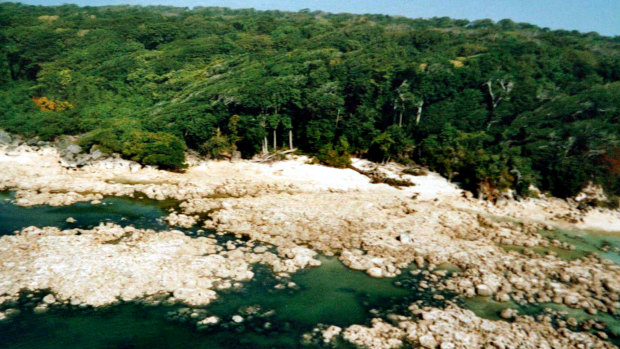 A view of the North Sentinel Island, from which the sea retreated after the 2004 tsunami, and exposed coral reefs (seen in the foreground).