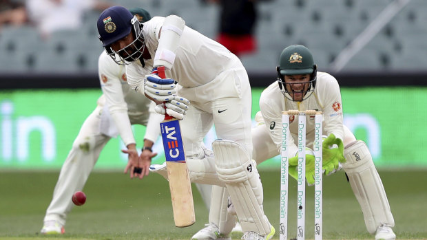 Dead bat: Cheteshwar Pujara met the challenge of Nathan Lyon with patient determination.