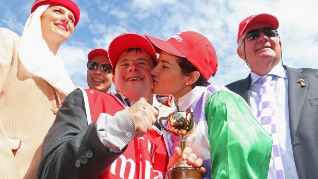 Michelle Payne kisses older brother Stevie after the historic 2015 Melbourne Cup win on Prince of Penzance.