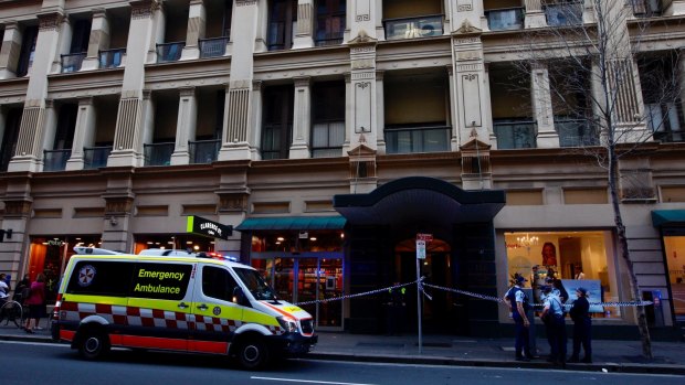 Emergency workers outside the apartment building on Clarence Street during the police operation on Tuesday.