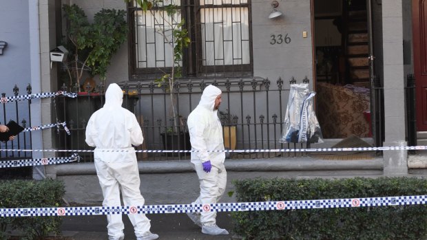 Police officers at the scene of the raid in Surry Hills, Sydney.