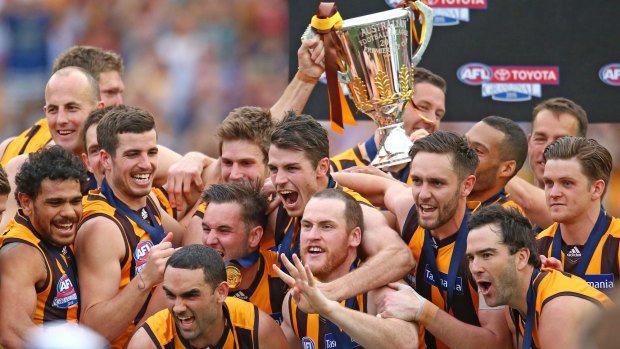 A happy team at Hawthorn after completing the rare three-peat against West Coast in 2015.