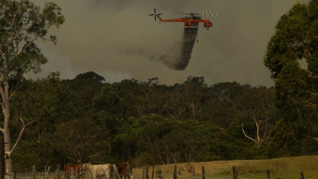 A waterbombing aircraft tackles a blaze in NSW during 2017.