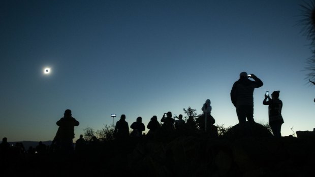 People view a total solar eclipse from La Higuera, Chile, in 2019.