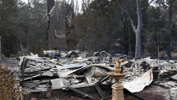 A burnt-out house is seen in Sarsfield, East Gippsland on Tuesday.
