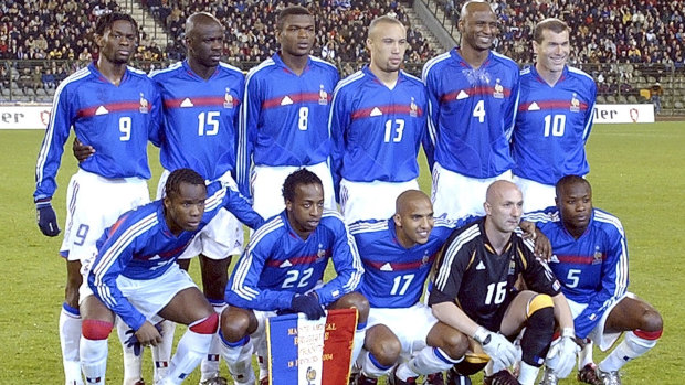 In 2004, Louis Saha (#9), poses with the French national soccer team in a photo which includes Zinedine Zidane (#10), Patrick Vieira (#4), William Gallas (#5) and Marcel Desailly (#8).