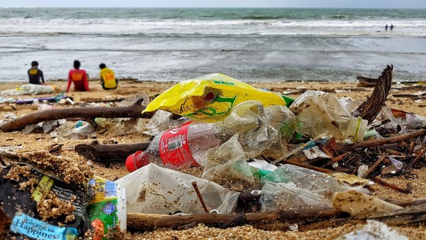 Bali's iconic surf beach in Kuta littered with plastic bottles, among other things.