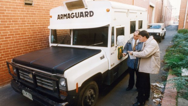 Forensic police examine the Armaguard van involved in the 1994 Richmond heist.
