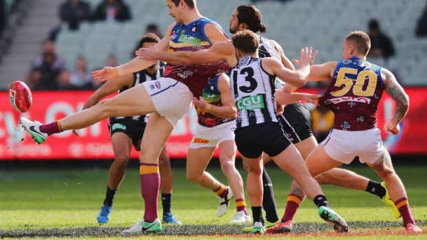 Collingwood and Brisbane playing on top of the Aboriginal flag in 2017.