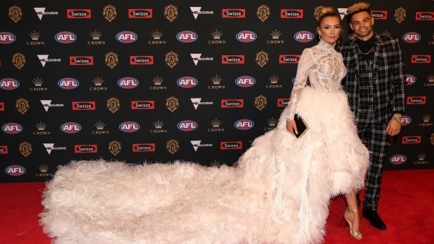 Jason Johannisen of the Western Bulldogs and partner Logan Shine on the red carpet.