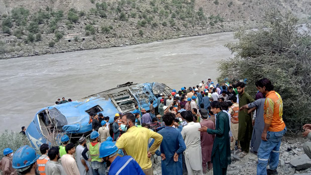 A bus carrying Chinese and Pakistani construction workers in north-west Pakistan fell into a ravine in an incident deemed a terrorist attack.