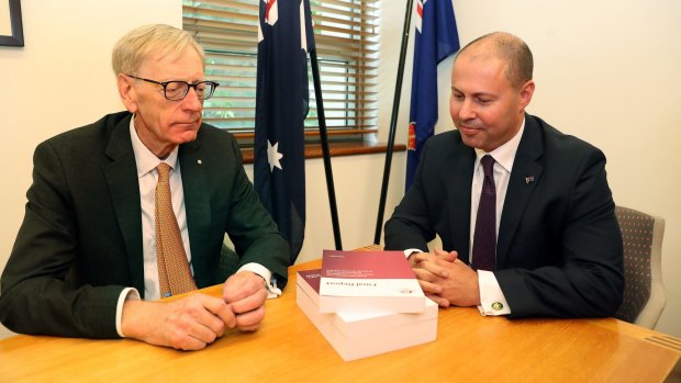 Commissioner Kenneth Hayne and Treasurer Josh Frydenberg, right, with the final report from the Royal Commission into misconduct in the Banking, Superannuation and Financial Services Industry.