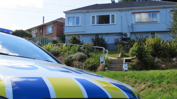 New Zealand police at the suspected gunman's house in Dunedin.