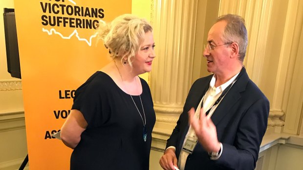 Andrew Denton  speaks with Health Minister Jill Hennessy at a pro-euthanasia event last year.