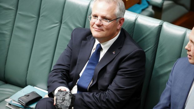 Treasurer Scott Morrison with a lump of coal during Question Time at Parliament House in Canberra in February 2017.