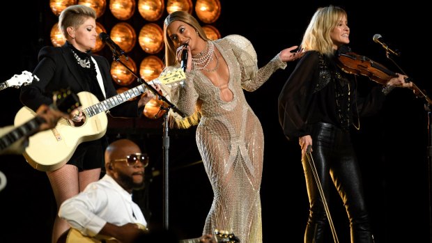 Australian brand J'Aton has benefited from working with Beyonce, pictured here at the 2016 Country Music Awards performing with the Chicks.