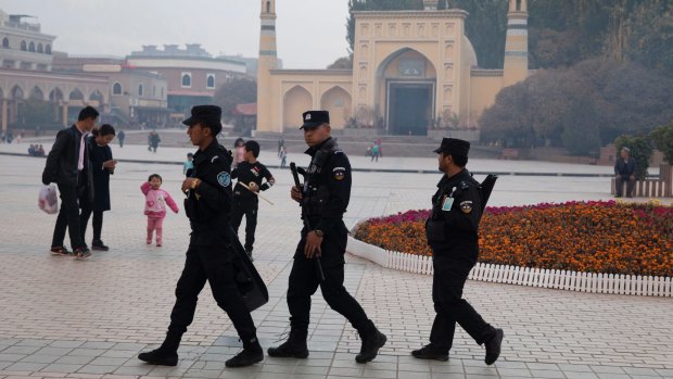 Security personnel on patrol in Xinjiang.