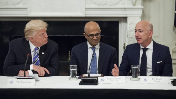 US President Donald Trump, Microsoft chief Satya Nadella and Amazon founder Jeff Bezos during the American Technology Council roundtable at the White House in 2017.