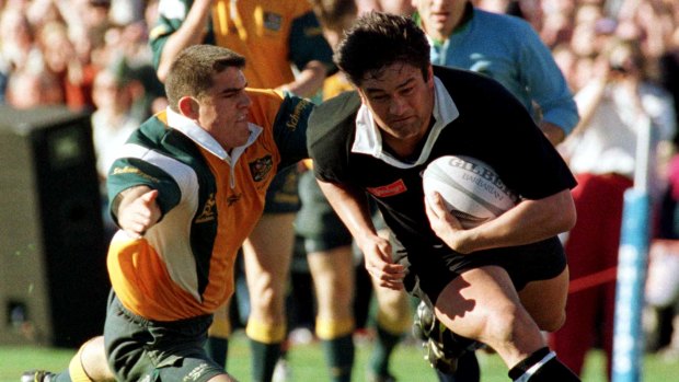 Holbeck attempts to make a tackle against the All Blacks during one of his seven Tests in 1997.