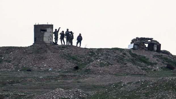 Uncertain future: Kurdish fighters of the YPG militia west of Kobane in northern Syria.